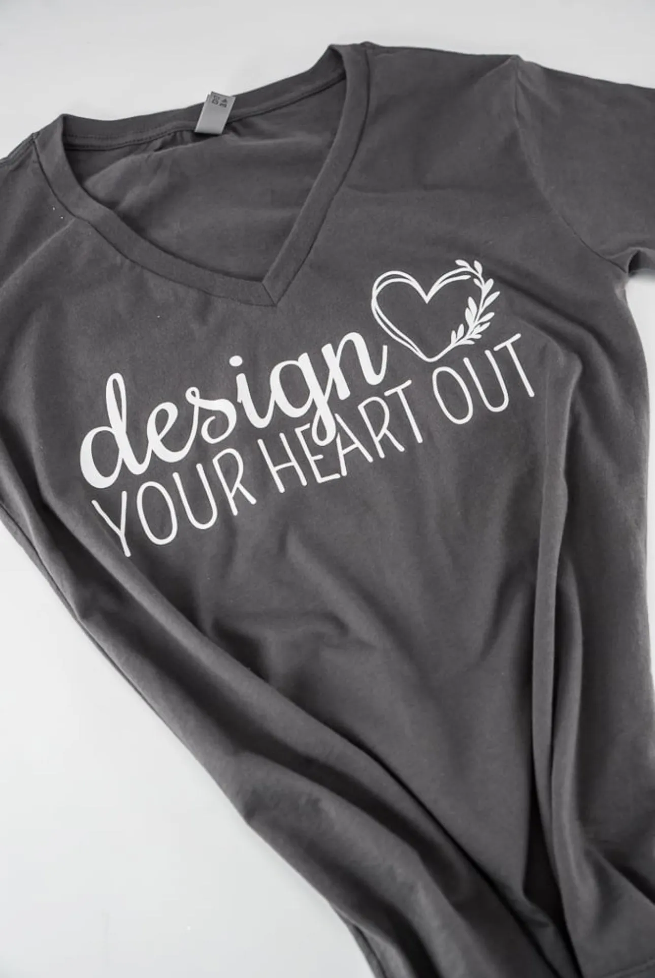 “Design your heart out” slate gray woman’s vneck - t-shirt